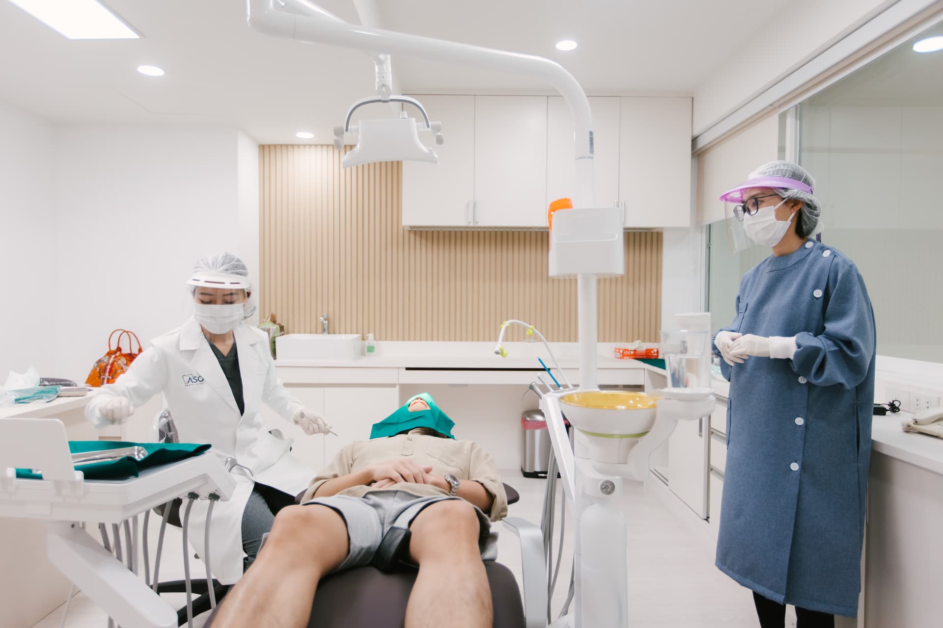 Dentist performing dental procedure