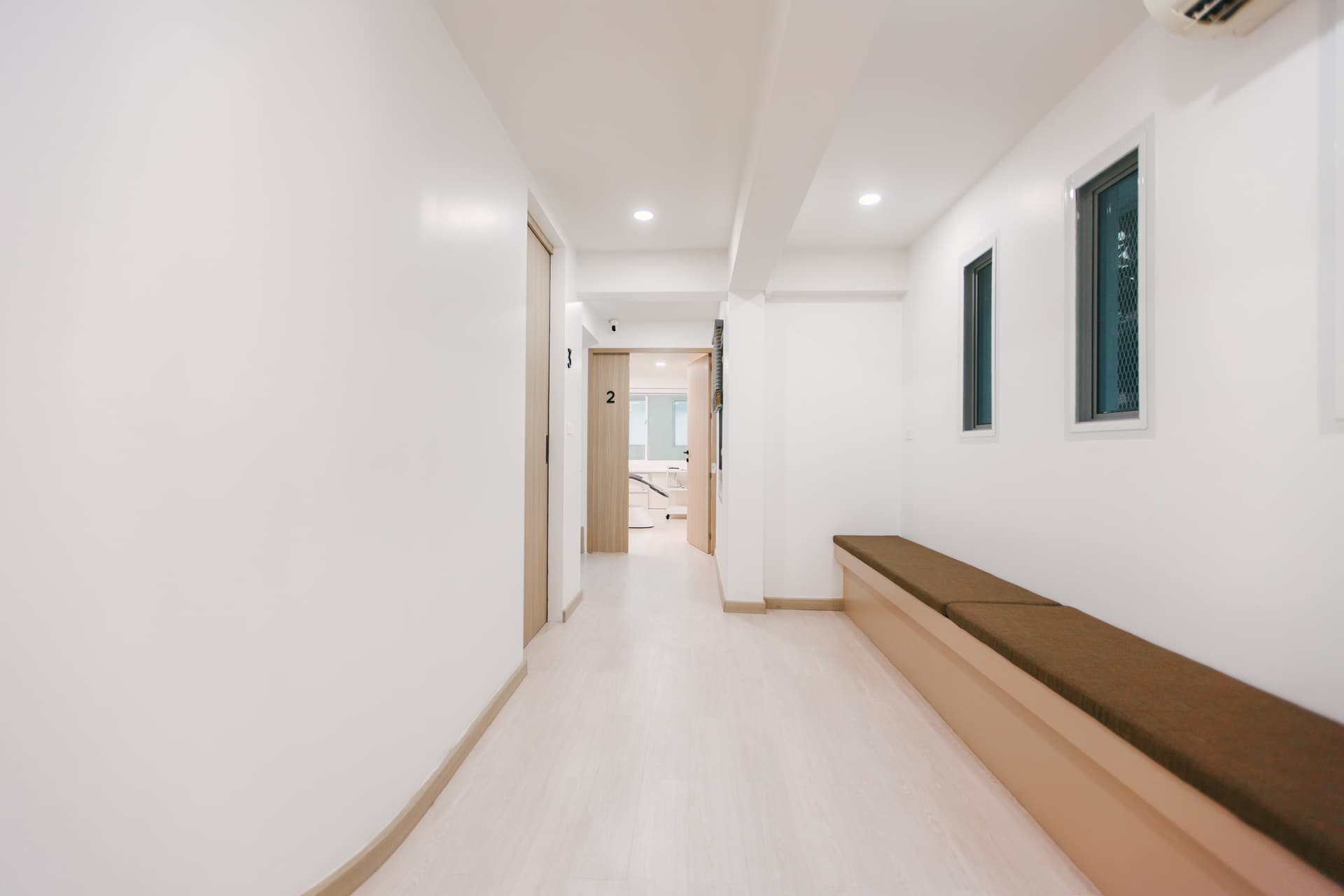 Hallway with numbered treatment room doors