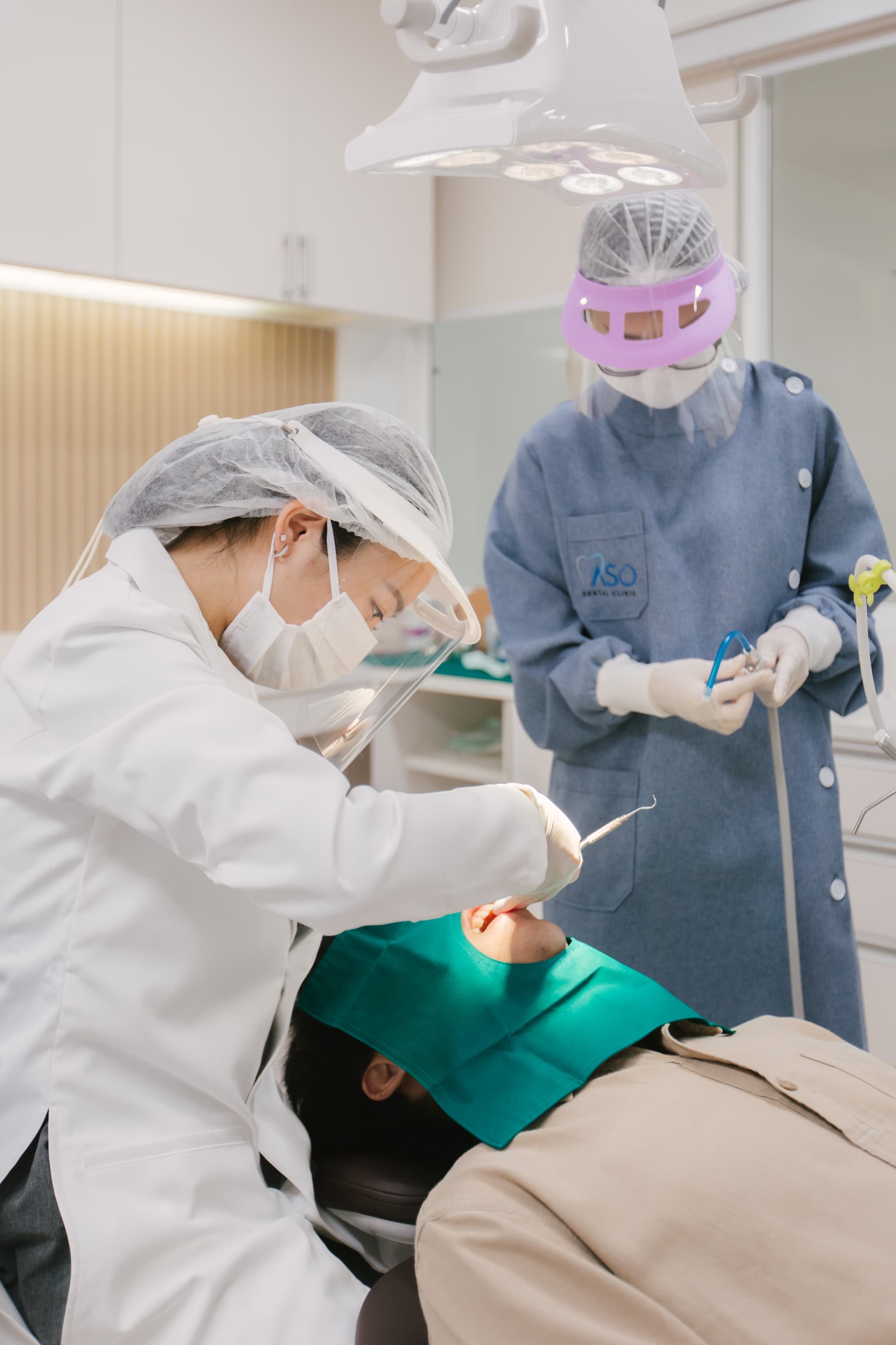 Dental assistant preparing treatment